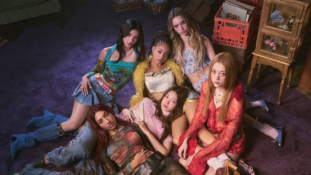 Katseye group photo, sitting on the floor.
